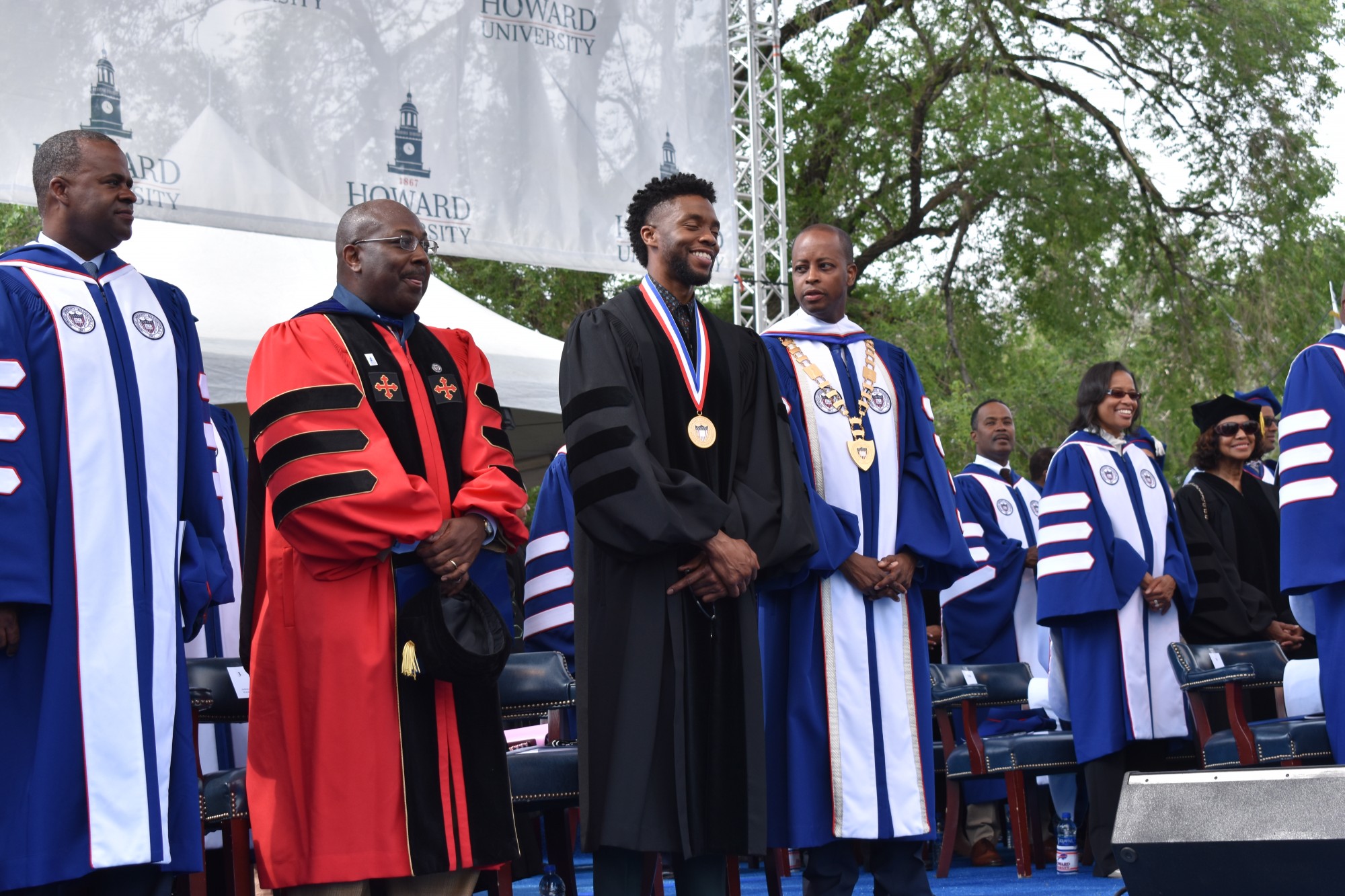 Boseman happily being a part of a graduation ceremony at Howard University while wearing a graduation gown.